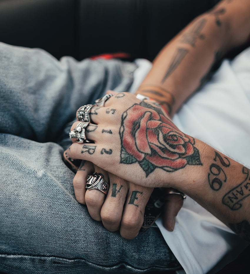 Avada Tattoo Gallery Woman with Tattoos on her Hands and Rings on her Fingers